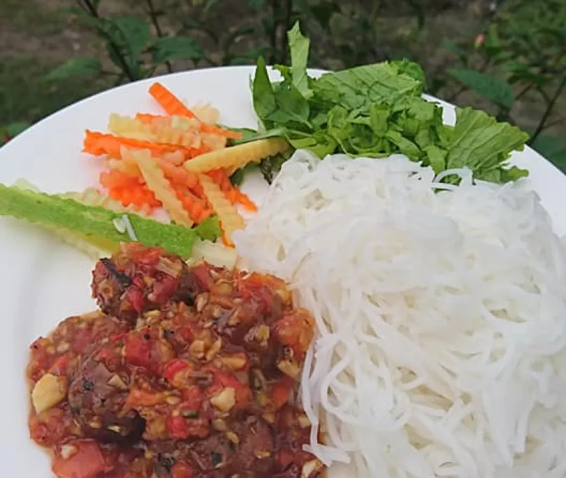 Fresh rice Noodle  with pork ball and tomato sauce