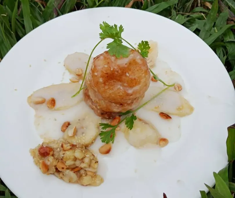 Vietnamese Vegan Sticky rice stuffed with Banana serve with Coconut Milk