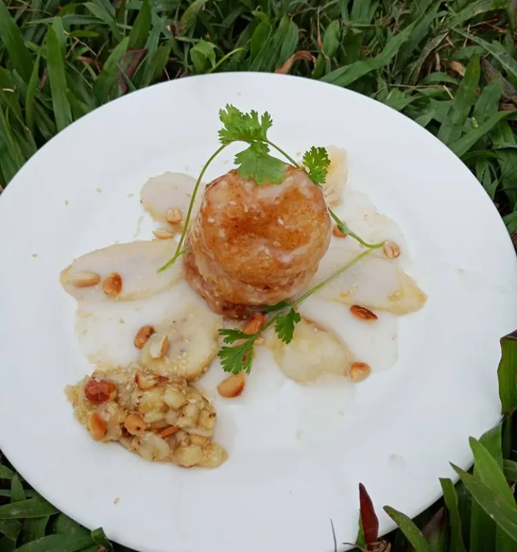 Vietnamese Vegan Sticky rice stuffed with Banana serve with Coconut Milk